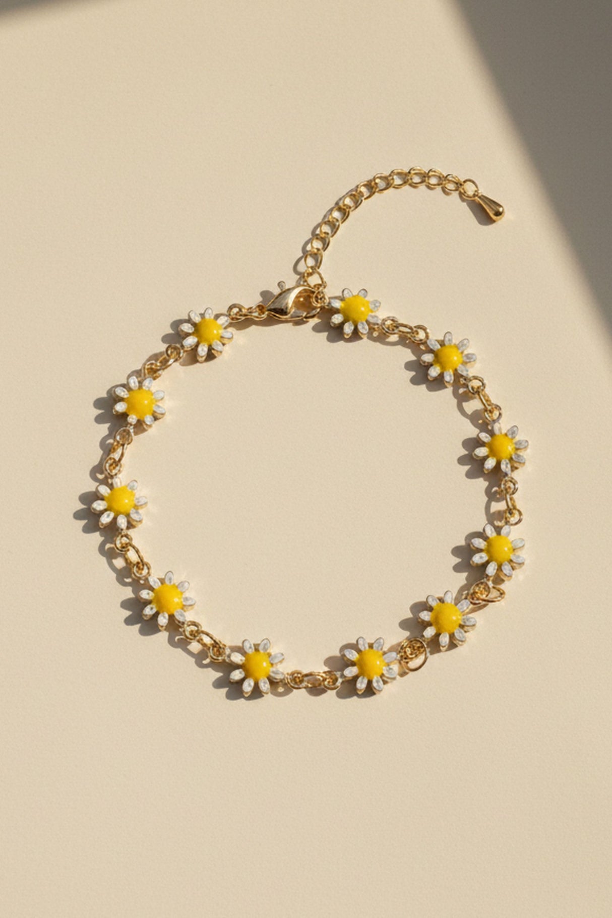 Bracelet chaîne à fleurs marguerites en ton or