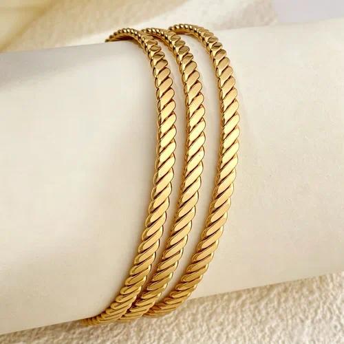 Style 003 three-ring textured gold-tone bangle set reference image