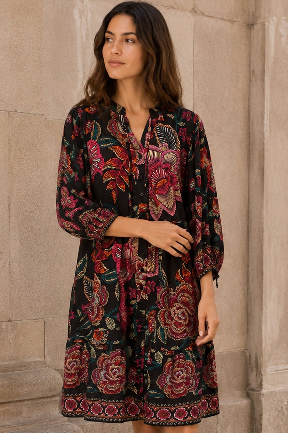 Mariah black multicolour floral dress three-quarter lifestyle view by stone doorway