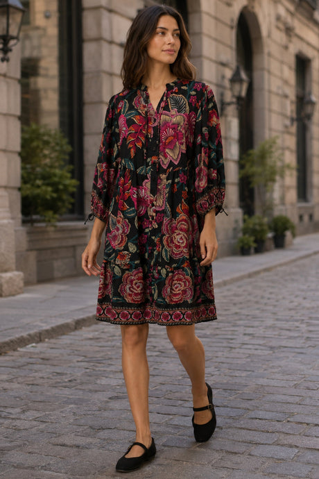 Mariah black multicolour floral dress walking lifestyle view in Old Montreal setting