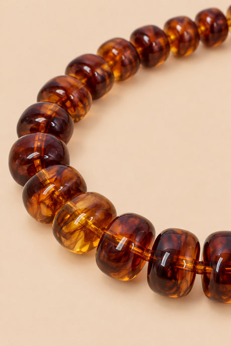 Close-up detail of brown translucent acrylic beads