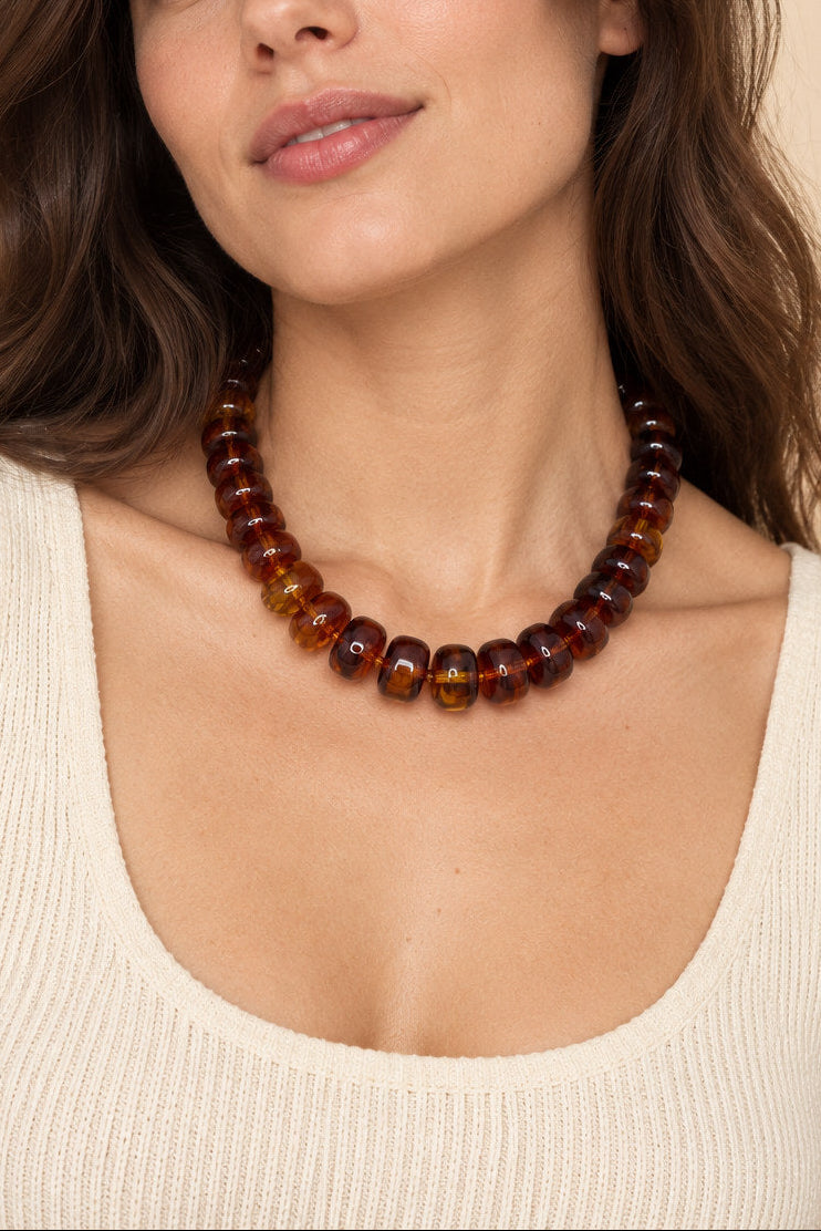 Brown translucent beaded necklace worn on model