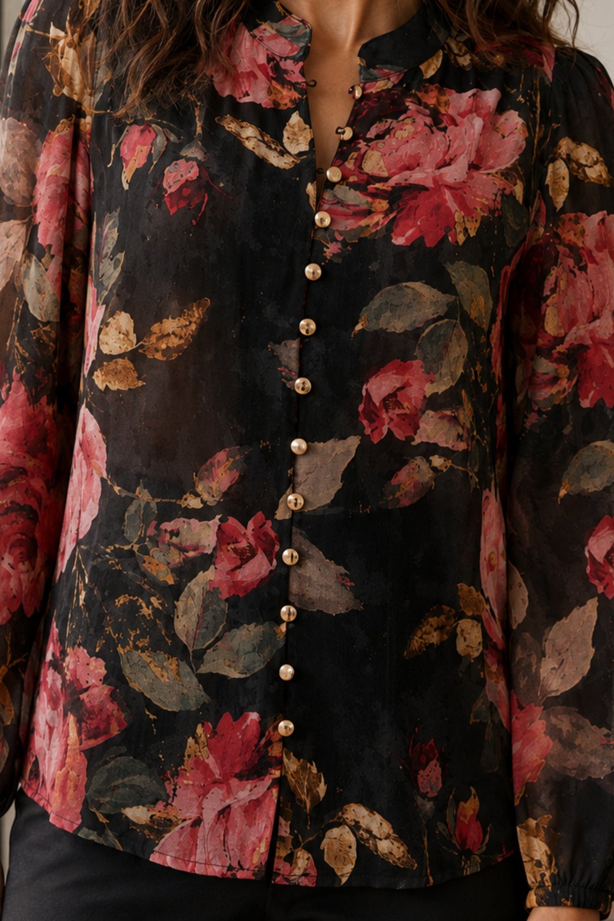 Makenzie blouse close-up showing textured floral fabric and gold buttons