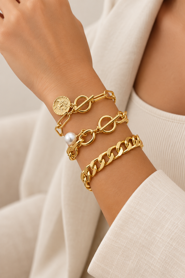 Gold-tone pearl coin bracelet set worn on wrist