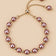 Mauve pink pearl slider bracelet on ONZE beige background.