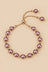 Mauve pink pearl slider bracelet on ONZE beige background.