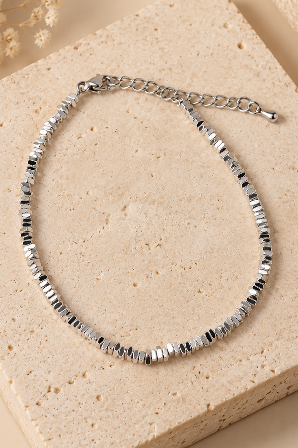 Silver-tone textured bracelet detail view