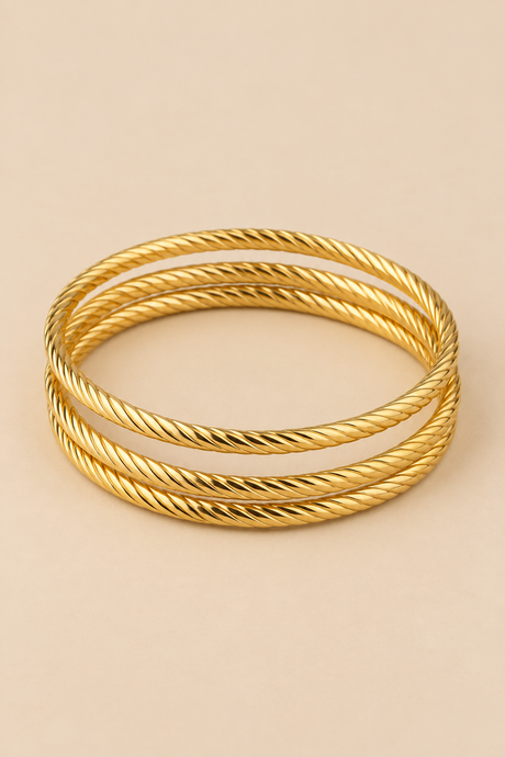 Style 002 three-ring gold-tone bangle set detail view