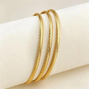 Style 002 three-ring gold-tone bangle set reference image