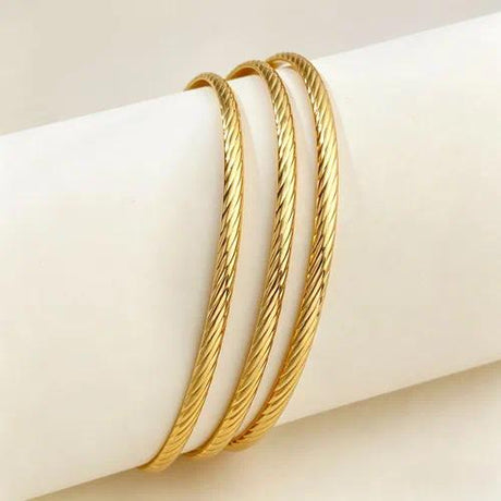 Style 002 three-ring gold-tone bangle set reference image