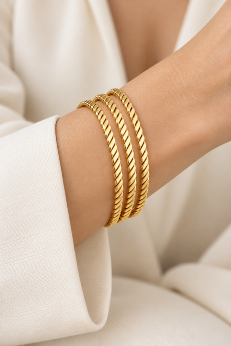 Style 003 three-ring textured gold-tone bangle set worn on wrist