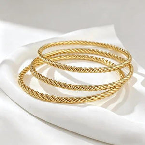 Style 010 three-ring textured gold-tone bangle set reference image