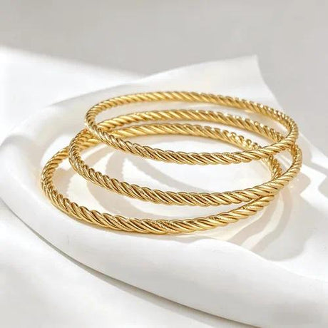 Style 010 three-ring textured gold-tone bangle set reference image