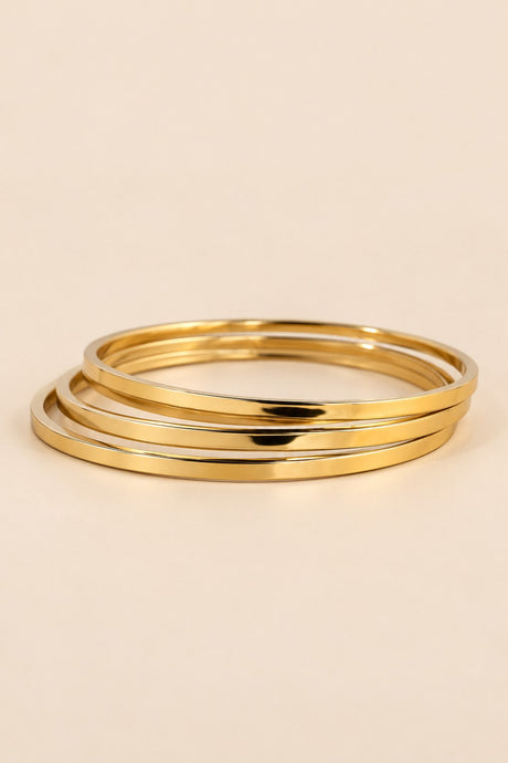 Gold-tone three-ring bangle set shown from an alternate angle.