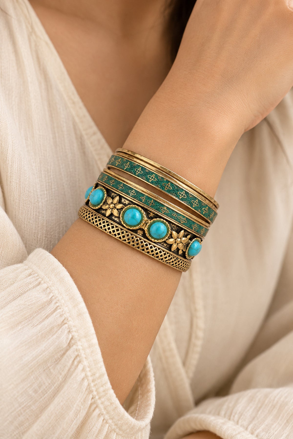Turquoise-tone and gold-tone vintage-inspired bangle set worn naturally on the wrist.